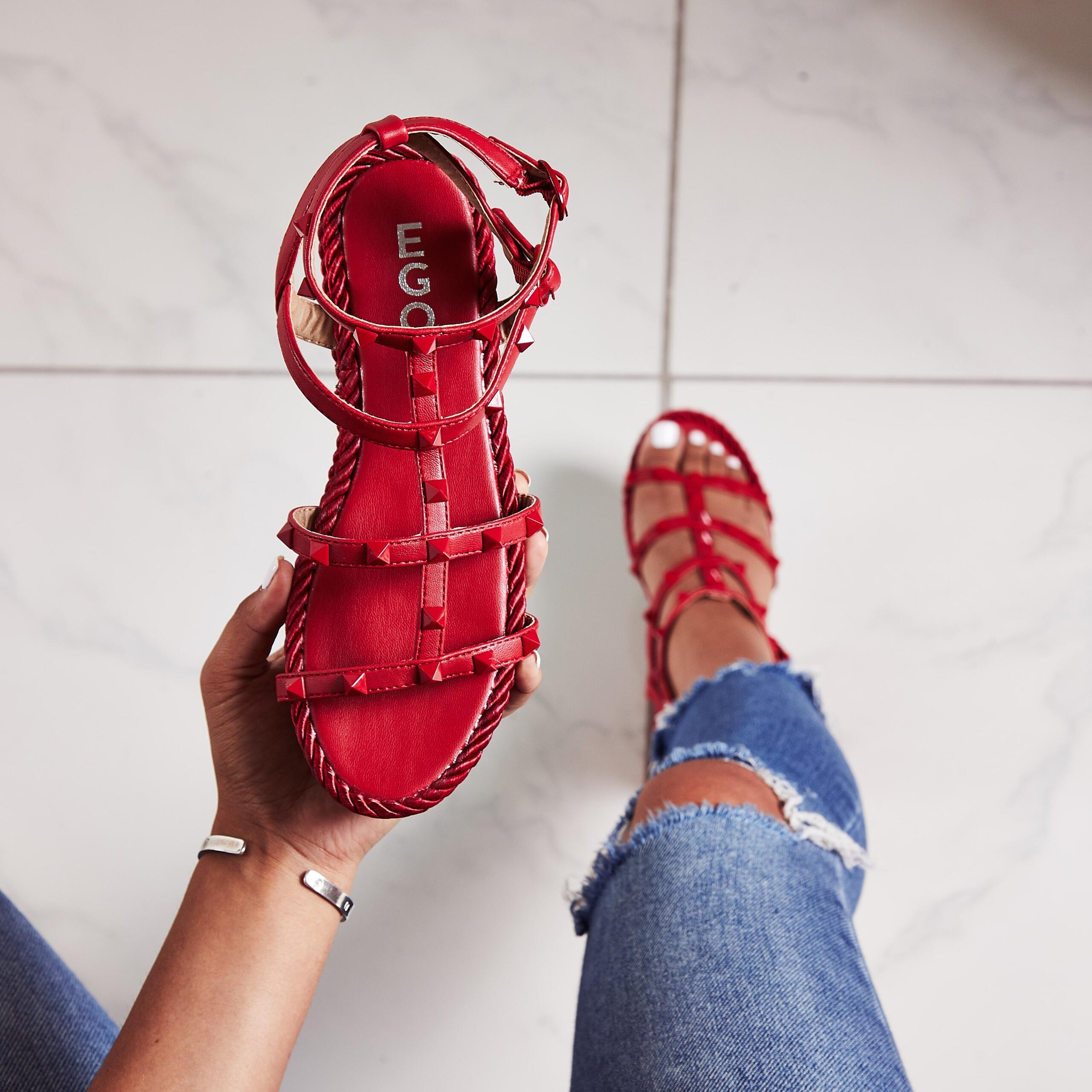 An image of a pair of red sandals, a great item to pack if you